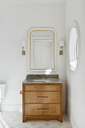 a view of bathroom with mirror and
