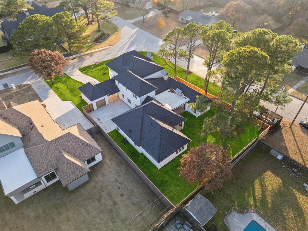 512 Bandit Trail Colleyville, TX 76034 - Photo 4 of 29 an aerial view of a house with a garden and trees