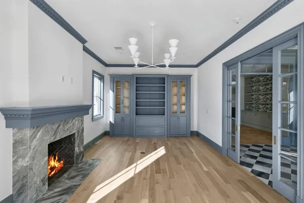 a view of an empty room and fire place