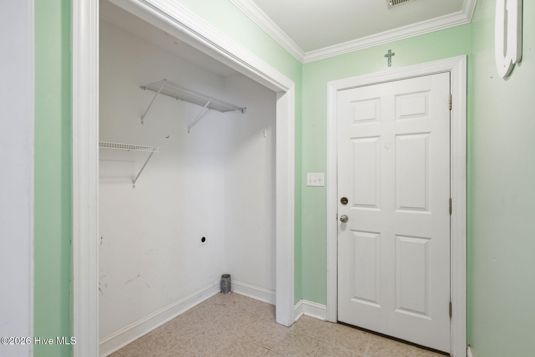 324 Ash Road Southport, NC 28461 - Photo 26 of 34 Door to garage and Laundry space