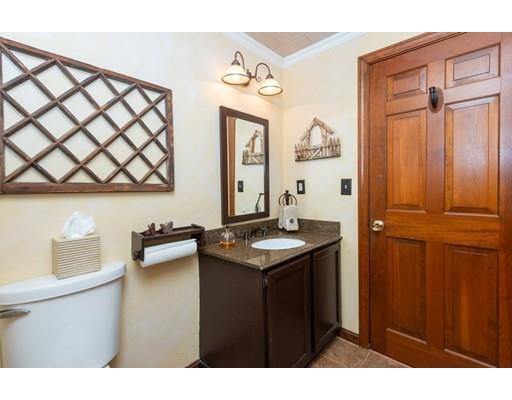 2 Roberts Road Ipswich, MA 01938 - Photo 17 of 37 a bathroom with a sink a mirror and a toilet