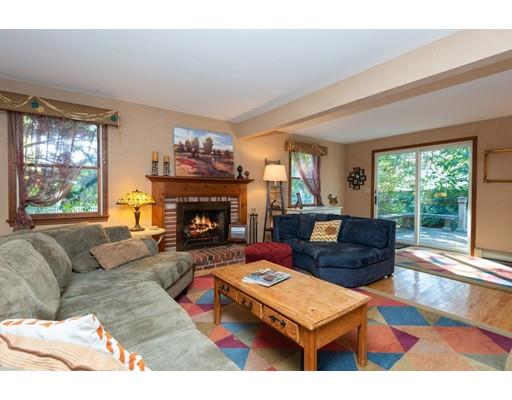2 Roberts Road Ipswich, MA 01938 - Photo 5 of 37 a living room with furniture a large window and a fireplace