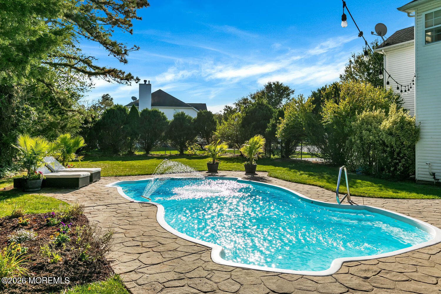 46 Woodview Drive Howell, NJ 07731 - Photo 14 of 17 a view of a swimming pool with a yard