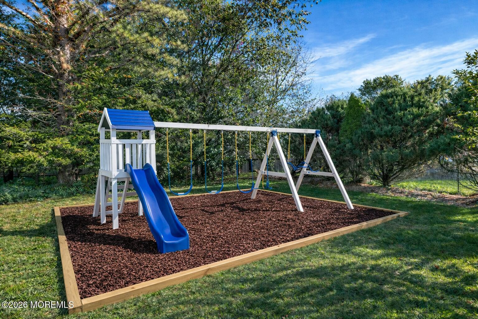 46 Woodview Drive Howell, NJ 07731 - Photo 17 of 17 a view of a yard with a slide