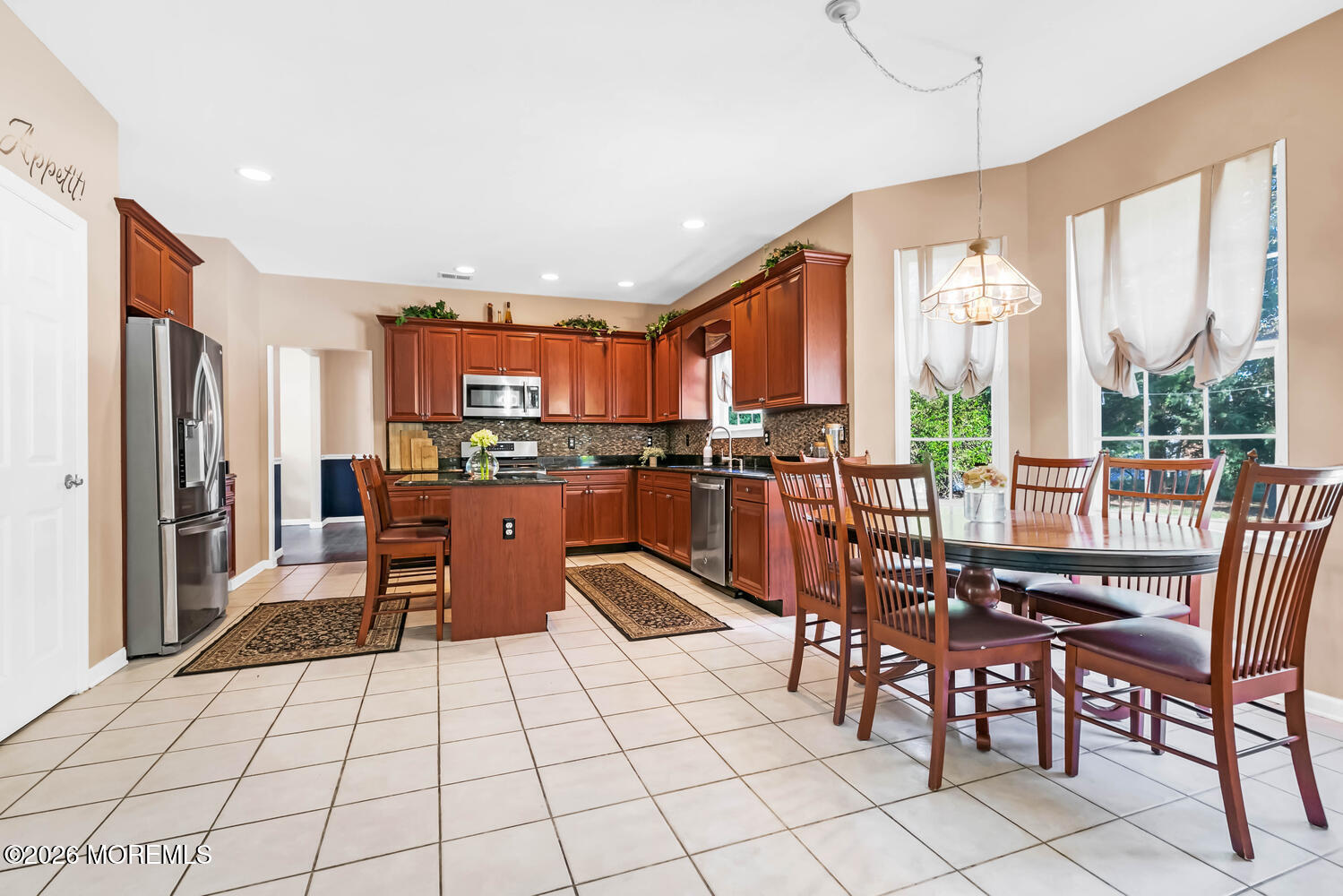 46 Woodview Drive Howell, NJ 07731 - Photo 6 of 17 a kitchen with stainless steel appliances kitchen island granite countertop a refrigerator and a stove top oven