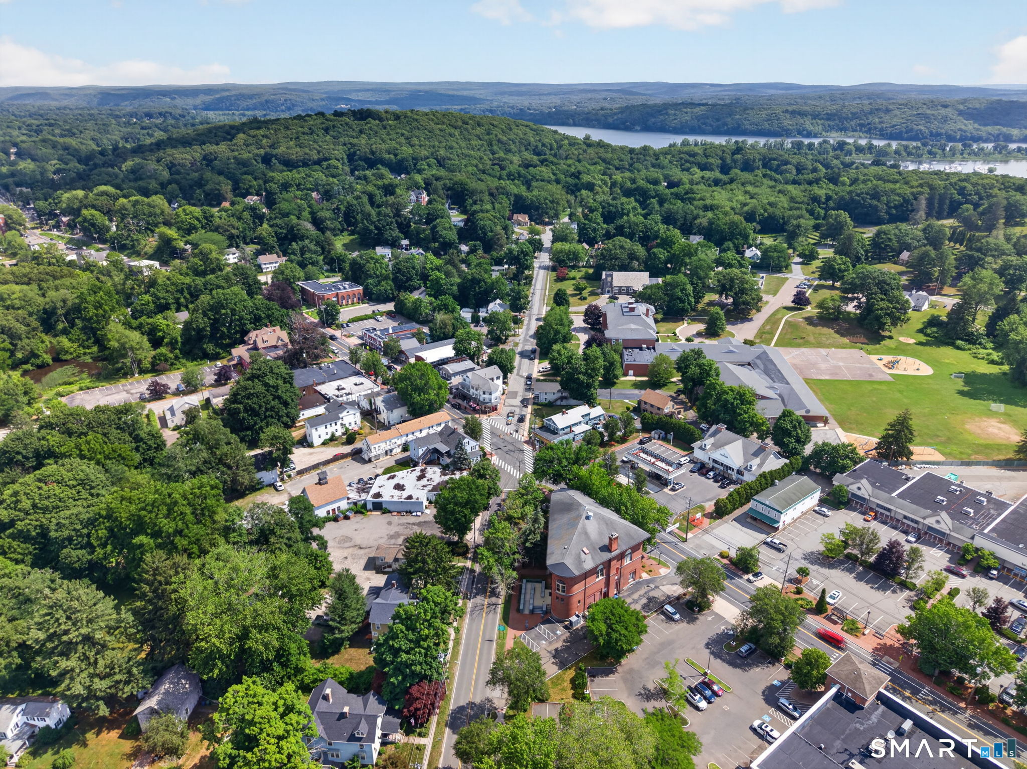 79 River Street Deep River, CT 06417 - Photo 36 of 40 an aerial view of residential houses with outdoor space and trees