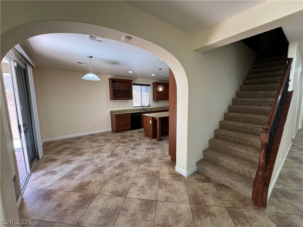 1333 Jamesbury Road Las Vegas, NV 89135 - Photo 43 of 43 An open floorplan seamlessly connects the kitchen and living areas, offering effortless movement throughout.