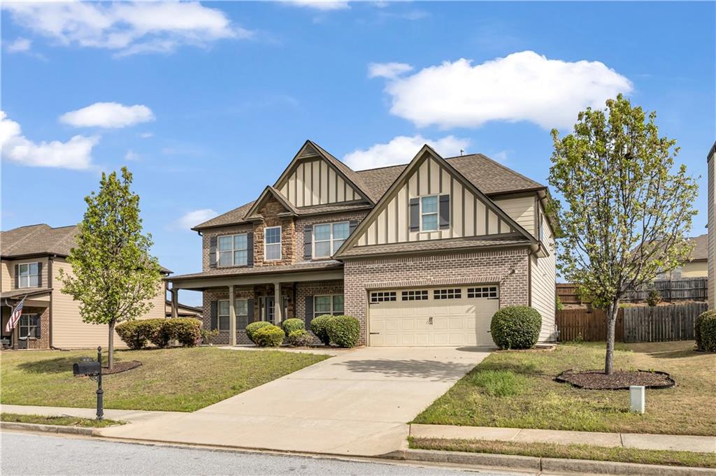 2626 Holden Spring Drive Dacula, GA 30019 - Photo 1 of 62 a front view of a house with garden