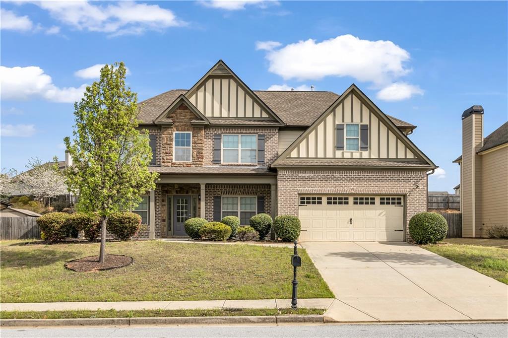 2626 Holden Spring Drive Dacula, GA 30019 - Photo 2 of 62 a front view of a house with a yard