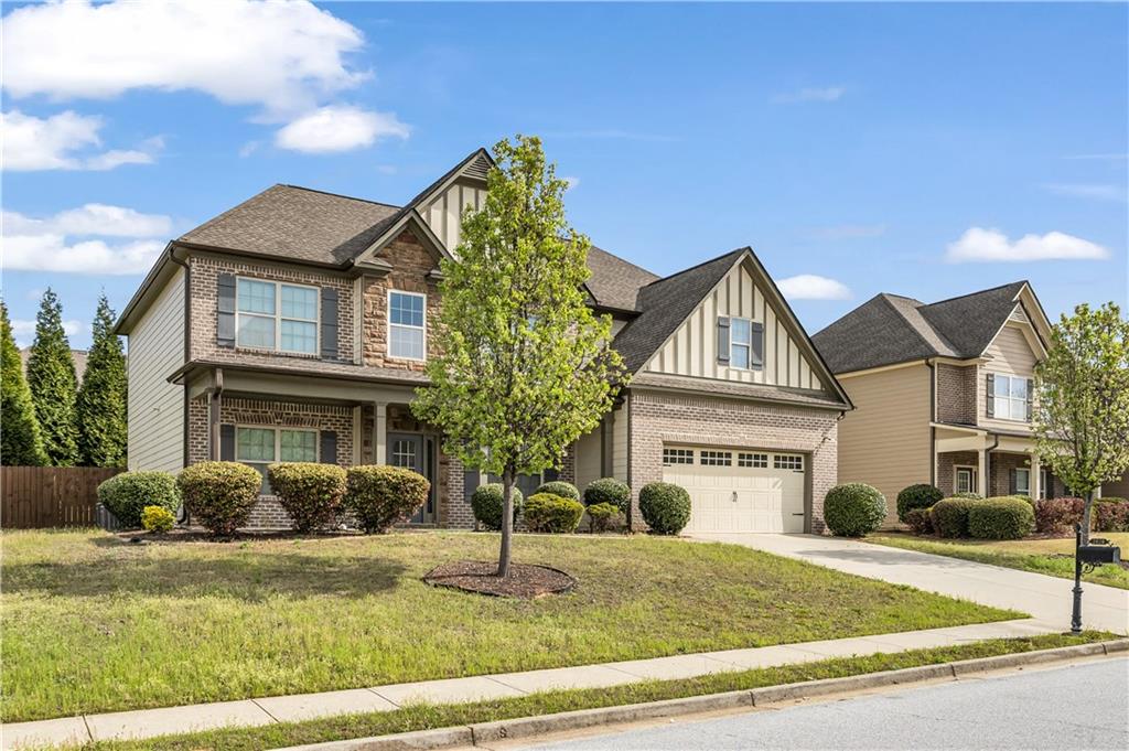 2626 Holden Spring Drive Dacula, GA 30019 - Photo 3 of 62 a front view of a house with garden