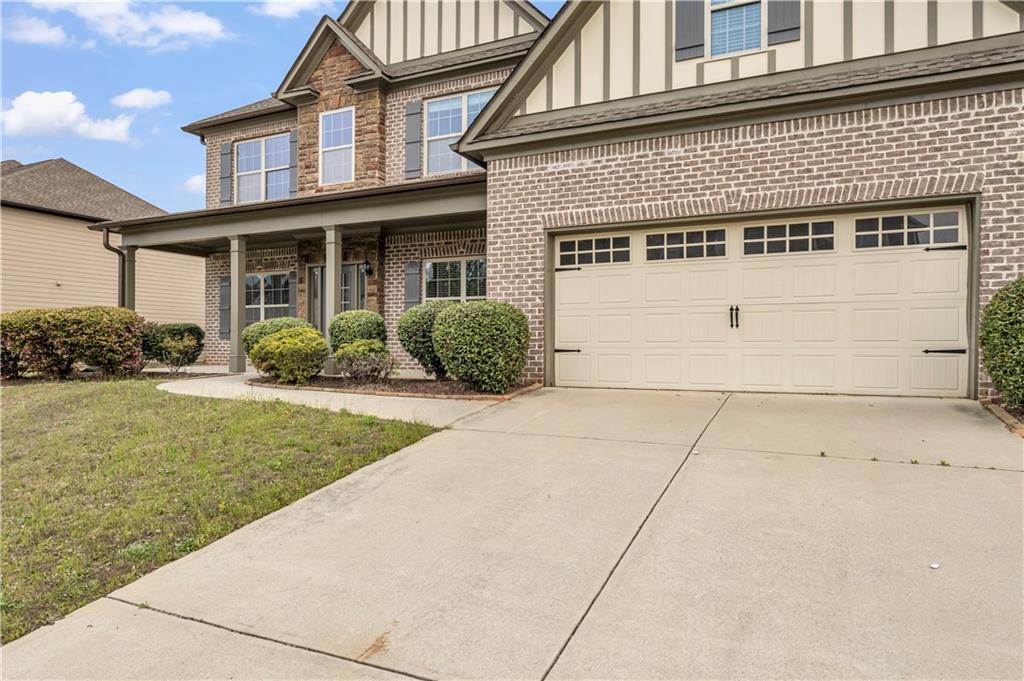 2626 Holden Spring Drive Dacula, GA 30019 - Photo 6 of 62 a view of a house with a yard