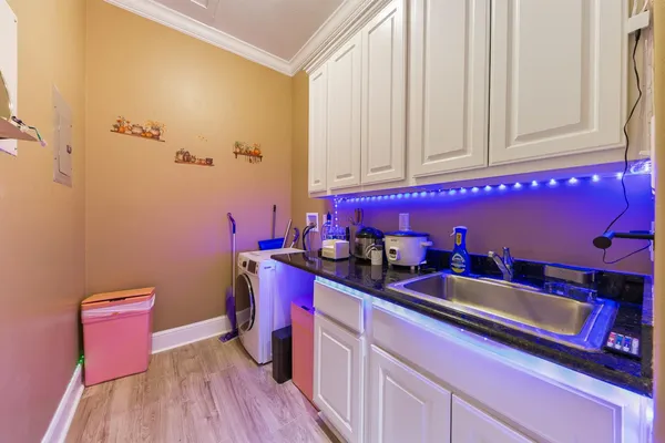 a kitchen with a sink and cabinets