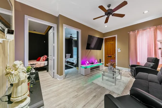 a living room with furniture and a flat screen tv