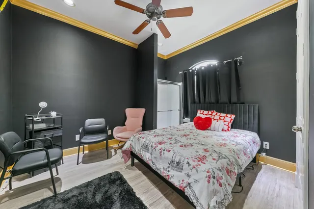 a bedroom with a bed and a lamp