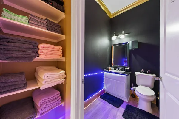 a bathroom with a toilet and a mirror