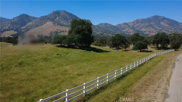 a view of a town with mountains in the background