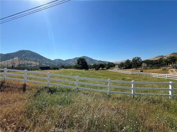 a view of a lake with a yard