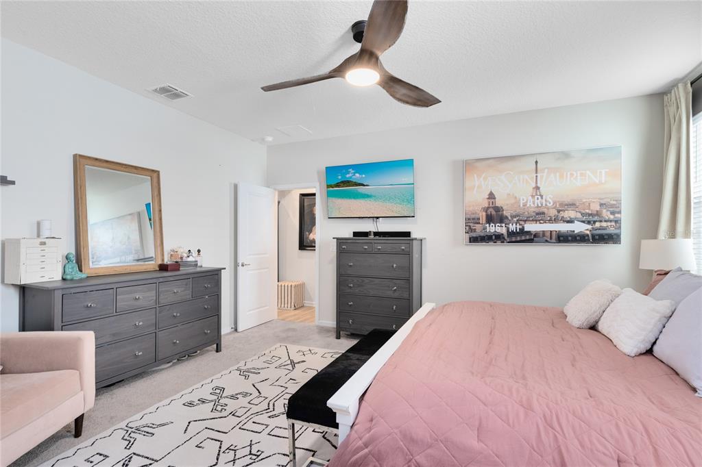 6528 Rover Way St. Cloud, FL 34771 - Photo 11 of 26 a bed room with a bed and a television