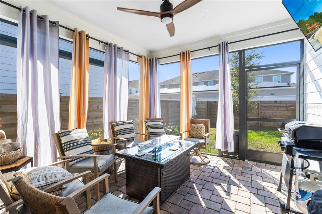 6528 Rover Way St. Cloud, FL 34771 - Photo 18 of 26 a living room with furniture and floor to ceiling windows
