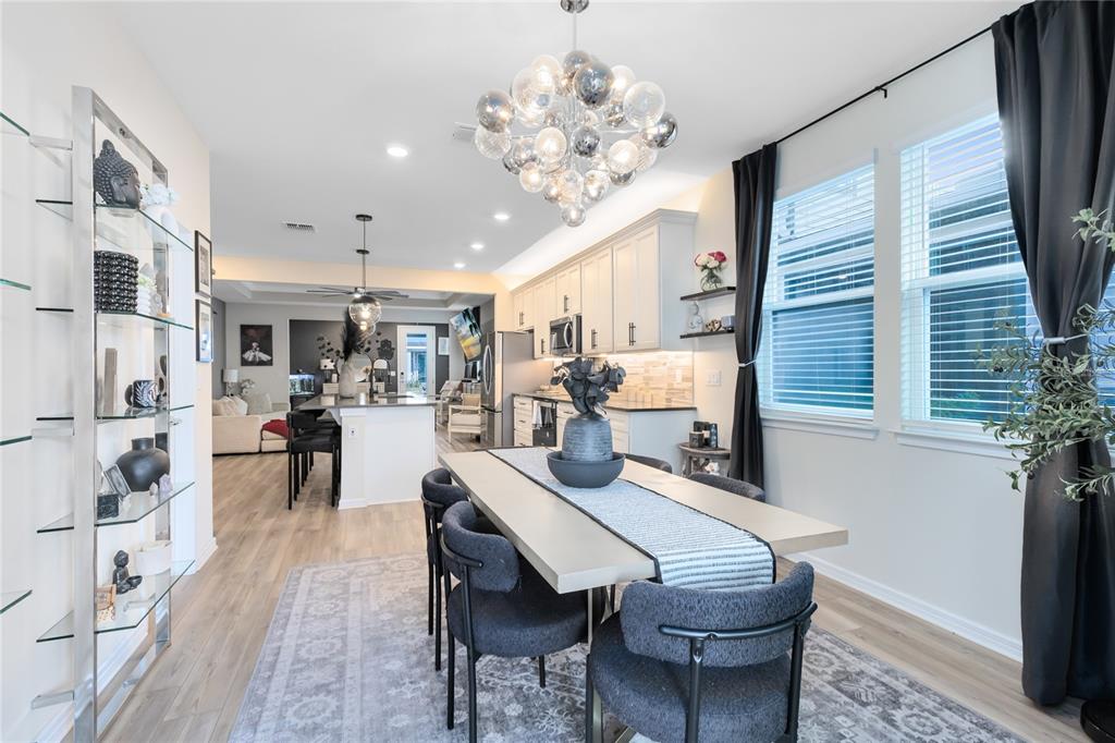 6528 Rover Way St. Cloud, FL 34771 - Photo 8 of 26 a view of a dining room with furniture and a chandelier
