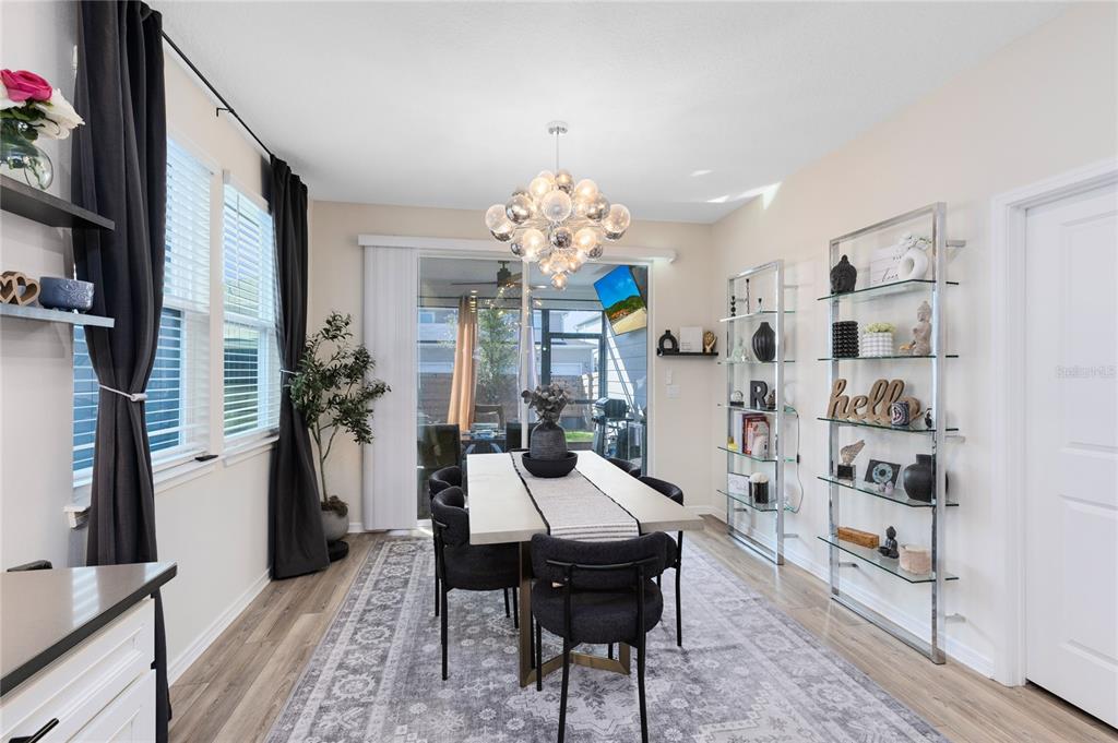 6528 Rover Way St. Cloud, FL 34771 - Photo 9 of 26 a living room with furniture and a chandelier