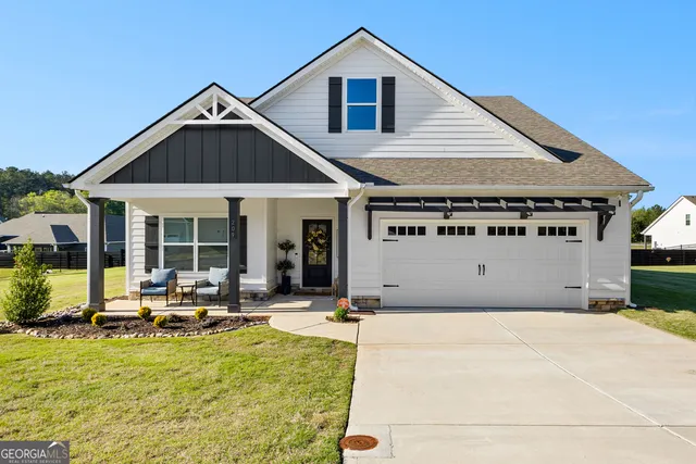 a kitchen with stainless steel appliances kitchen island granite countertop a sink and cabinets