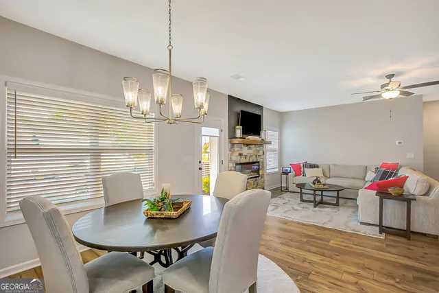 a bathroom with double vanity sinks and a shower