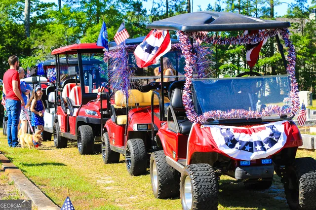 a front view of a building with a garden and plants