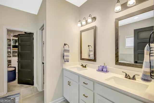 a front view of a house with yard and garage