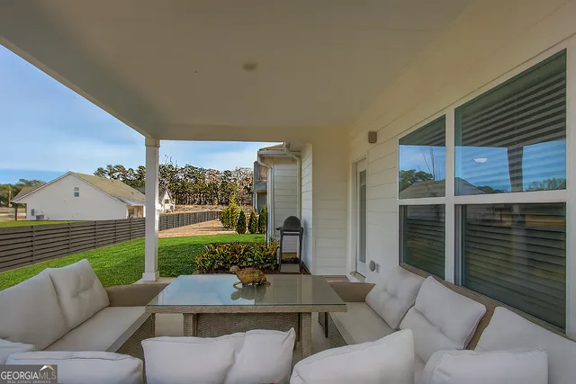 a living room with furniture fireplace and flat screen tv