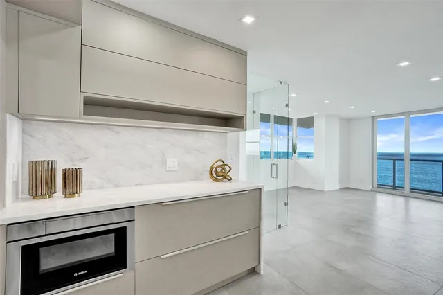 a kitchen with stainless steel appliances a stove and a refrigerator
