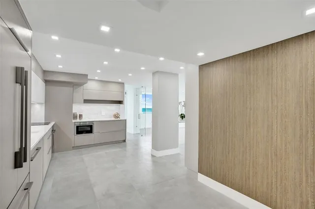 a hallway with a wooden floor and entryway