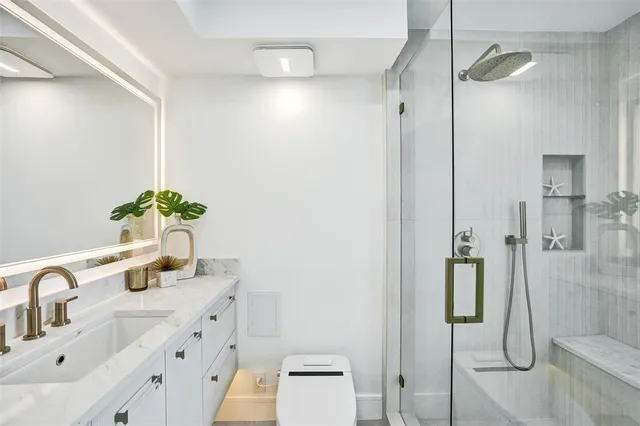 a view of cabinets and window with cabinet