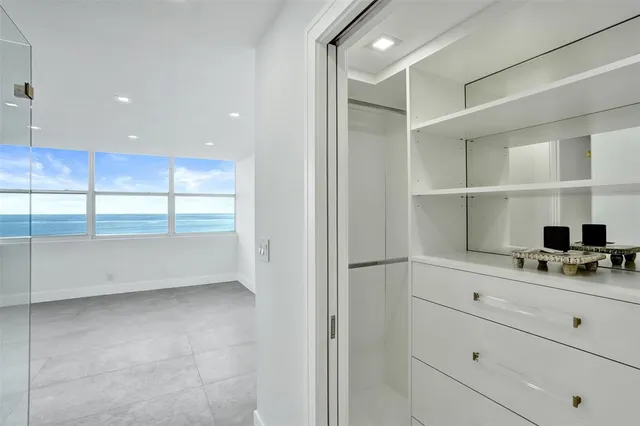 a view of a bathroom with a glass door shower
