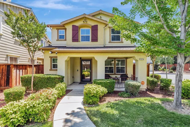 front view of a house with a yard