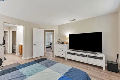 a living room with furniture and flat screen tv