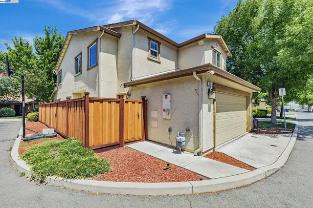 a front view of a house with garage