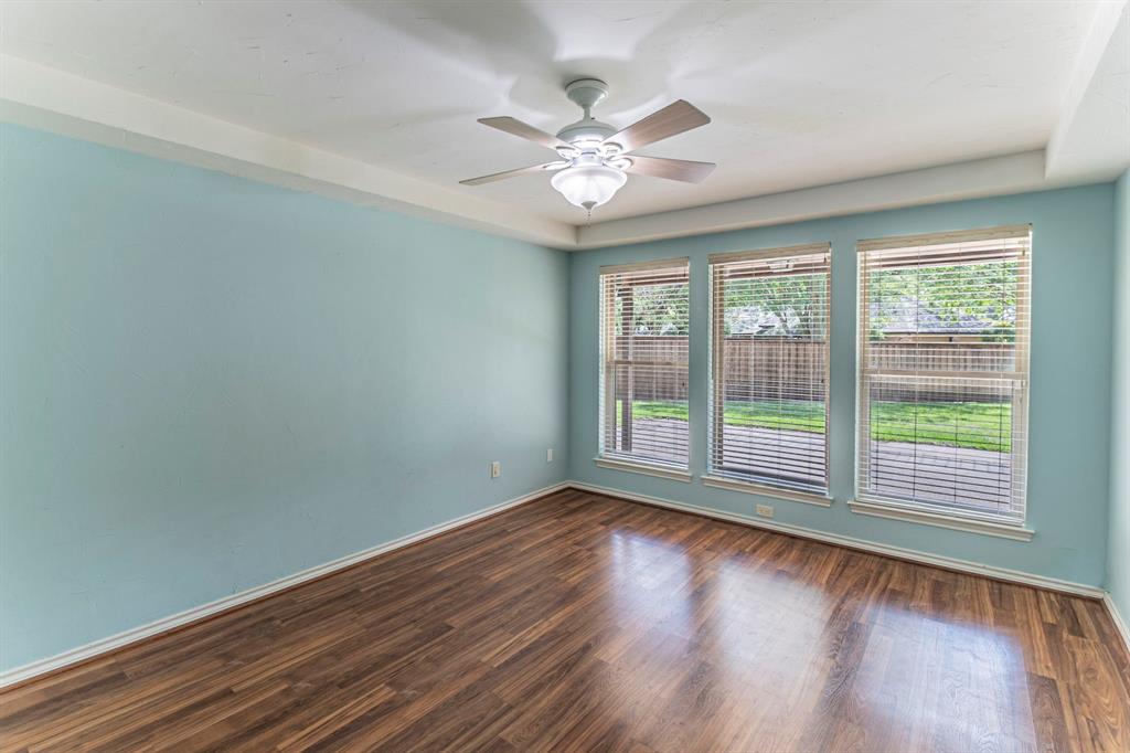 127 Nicklaus Nook Lancaster, TX 75146 - Photo 28 of 37 Spare room featuring dark wood-type flooring and ceiling fan