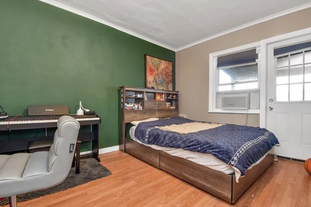 a bedroom with a bed and window