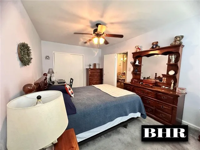 a bed room with a bed and a television