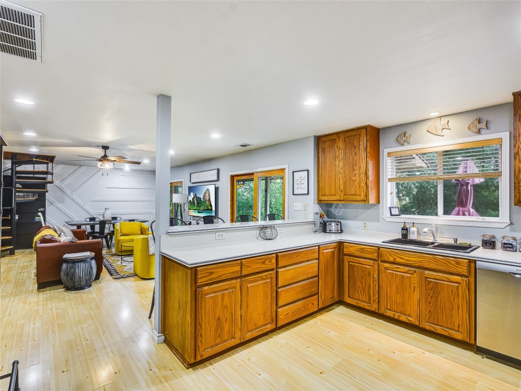 11000 Beach Road Leander, TX 78641 - Photo 11 of 38 a kitchen with a sink and cabinets