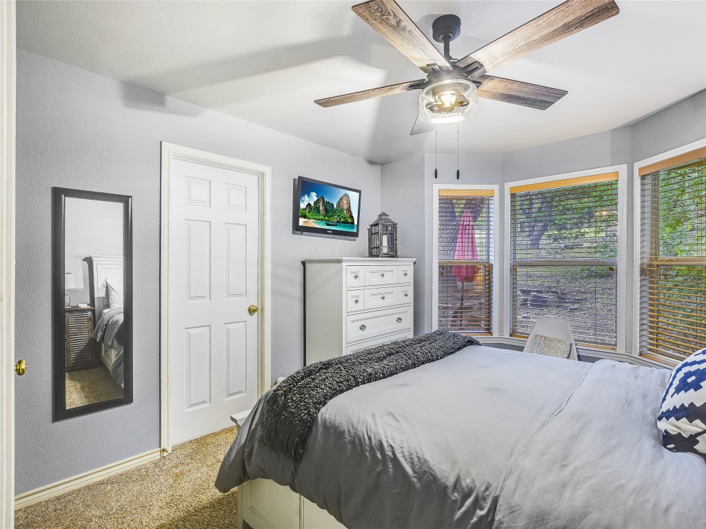 11000 Beach Road Leander, TX 78641 - Photo 16 of 38 a bedroom with a large bed and a window