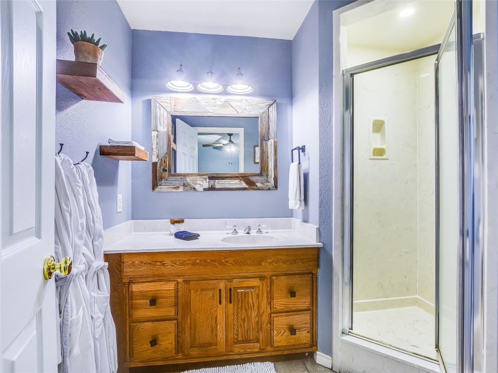 11000 Beach Road Leander, TX 78641 - Photo 17 of 38 a bathroom with a sink vanity and mirror