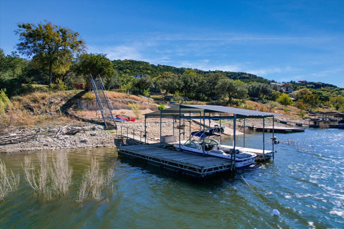 11000 Beach Road Leander, TX 78641 - Photo 30 of 38 a small pool with lawn chairs and a table