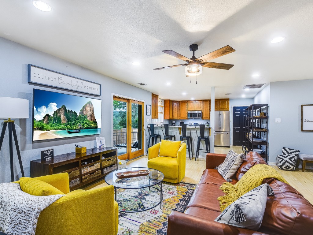11000 Beach Road Leander, TX 78641 - Photo 4 of 38 a living room with furniture kitchen view and a large window
