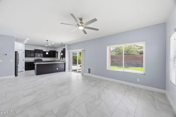 a view of a kitchen with a sink and a window
