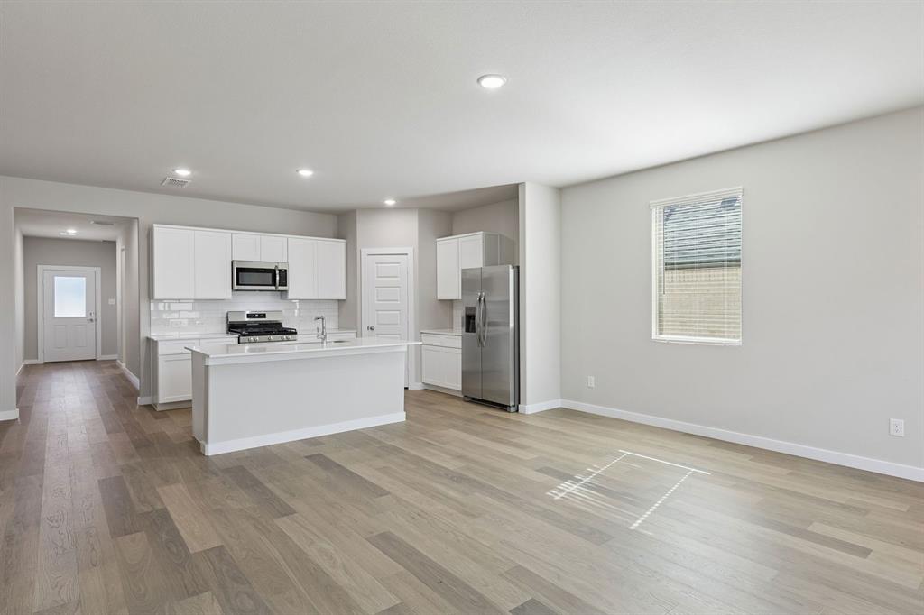 9648 Rango Road Fort Worth, TX 76123 - Photo 11 of 39 Kitchen and Dining Room in the Holden home plan by Trophy Signature Homes – REPRESENTATIVE PHOTO