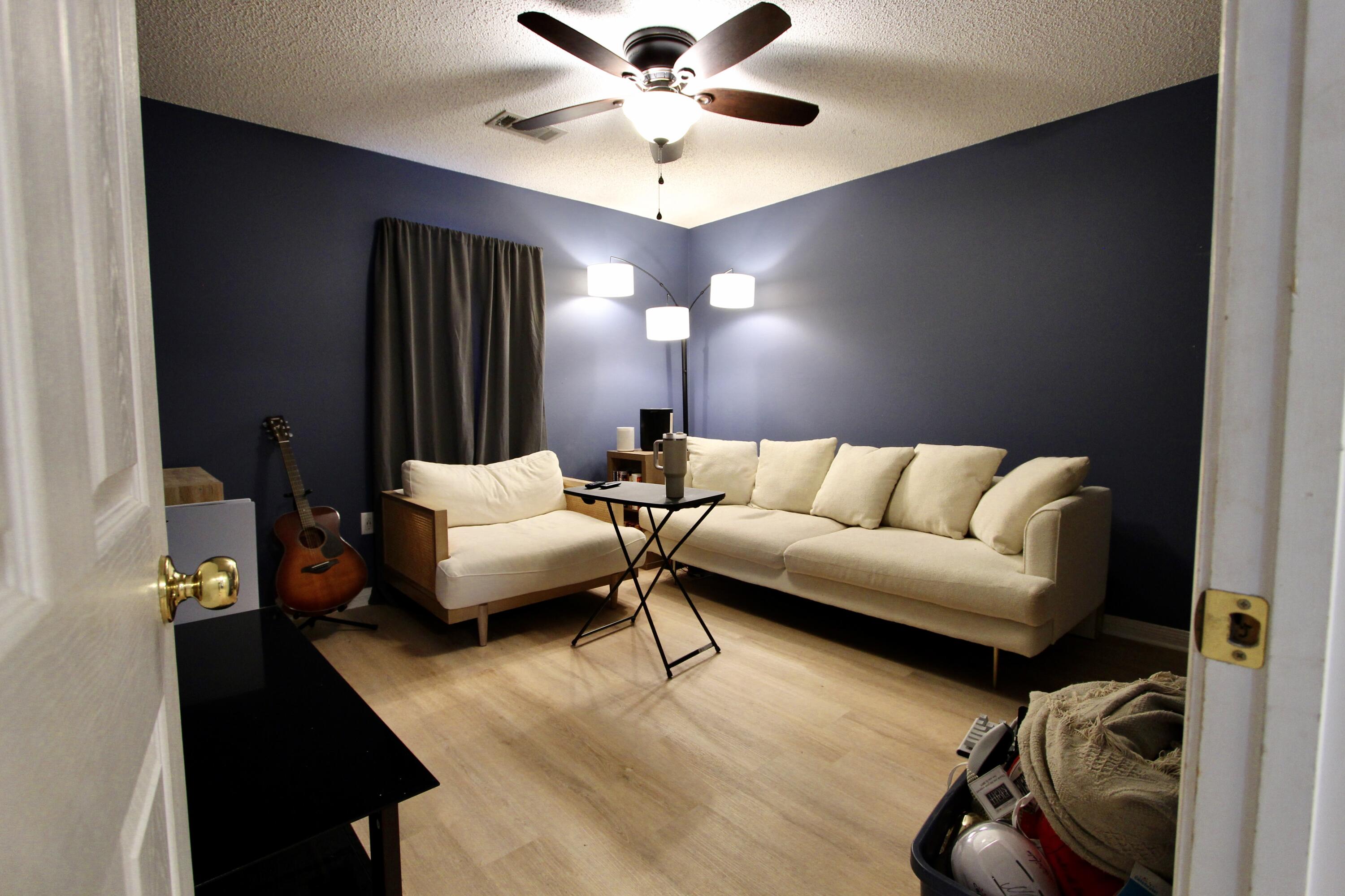 3150 Skyhawk Drive Crestview, FL 32539 - Photo 17 of 26 a living room with furniture and a chandelier