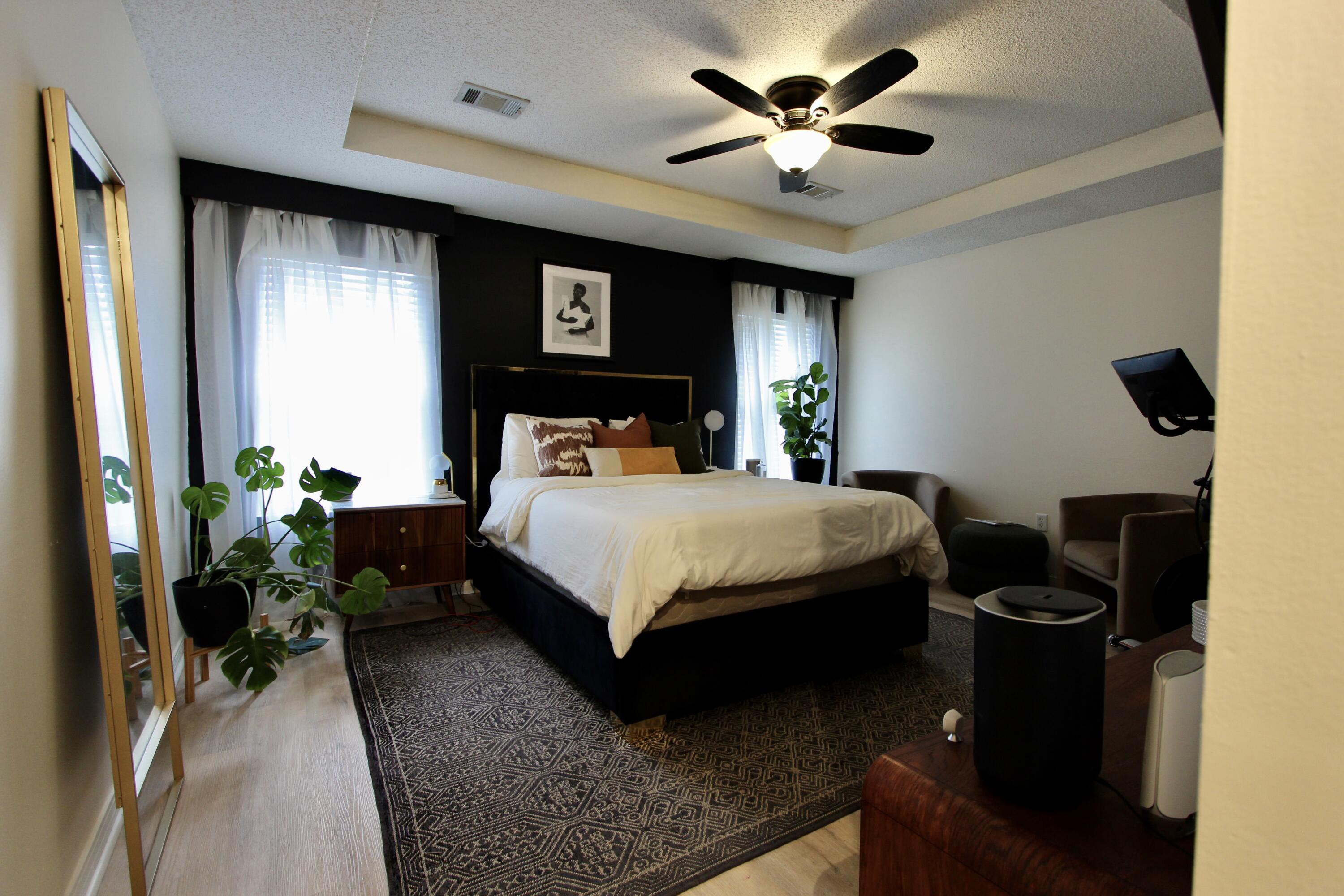 3150 Skyhawk Drive Crestview, FL 32539 - Photo 18 of 26 a bedroom with a bed potted plant on dresser and a window