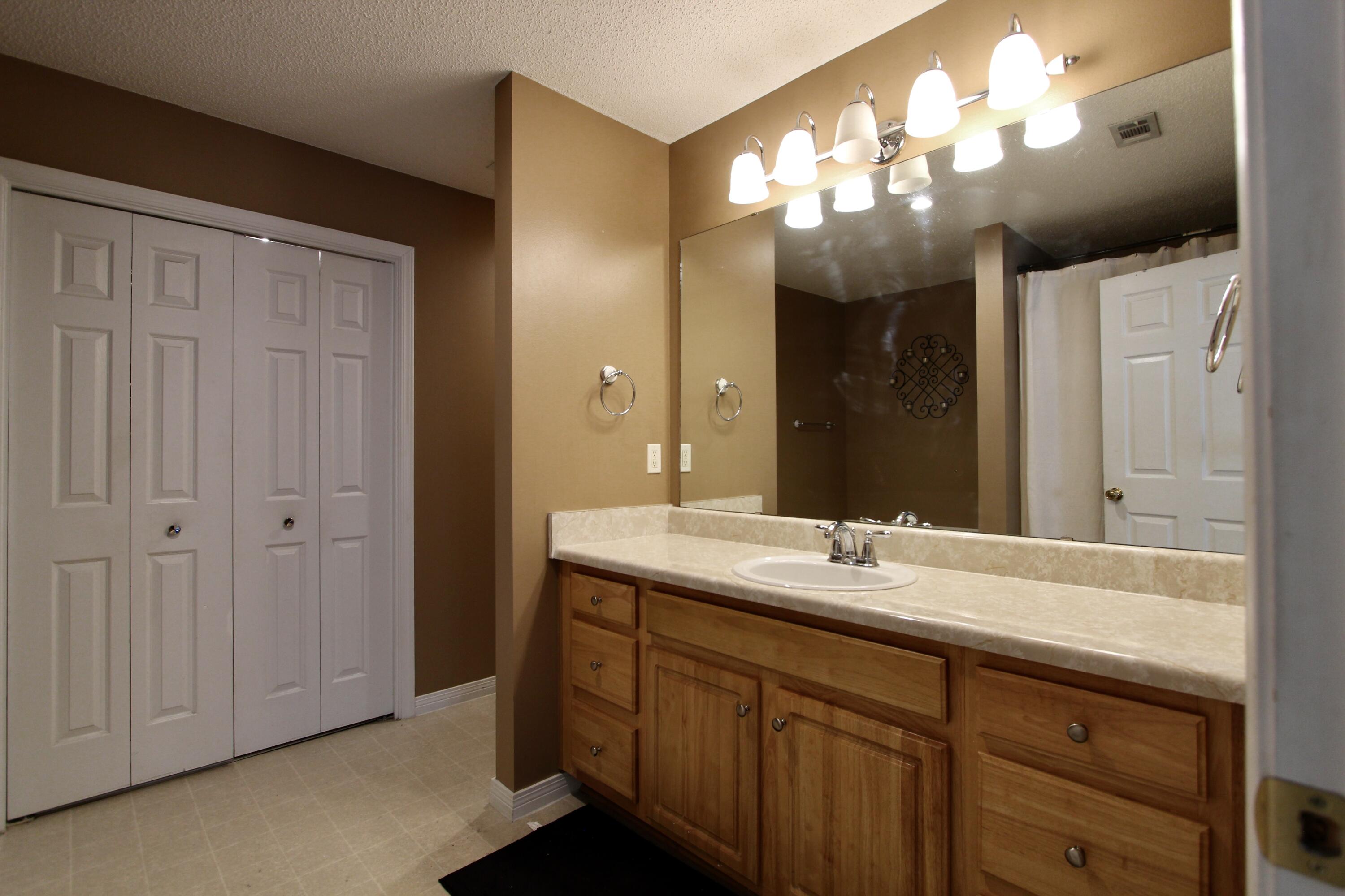 3150 Skyhawk Drive Crestview, FL 32539 - Photo 19 of 26 a bathroom with a double vanity sink and a mirror